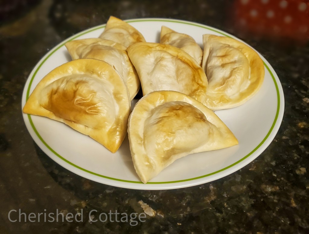 Crispy pierogies on plate